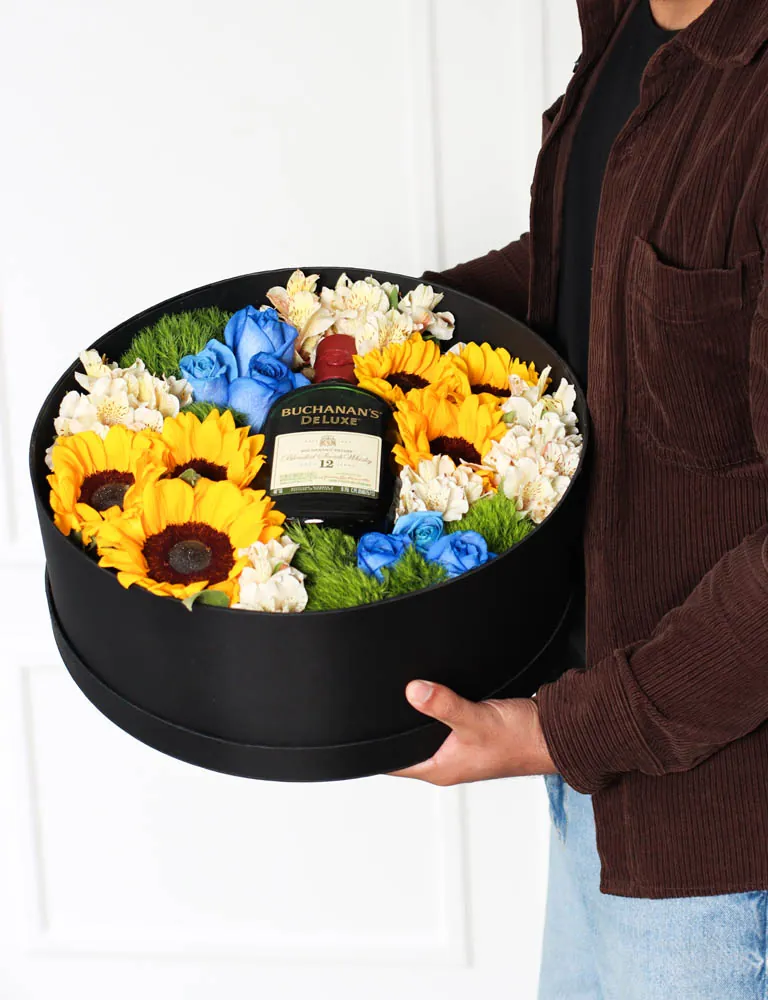 CAJA REDONDA GIRASOLES Y MIX DE FLORES (Incluye botella)